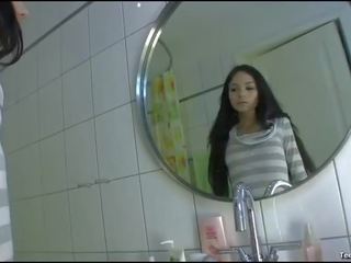 Brunette deity movies her shaved twat in the bathroom solo