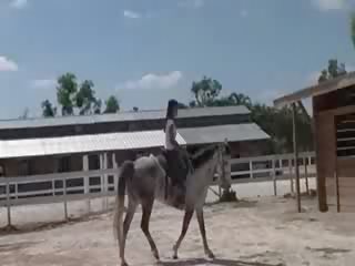 Chick from Thailand riding a horse