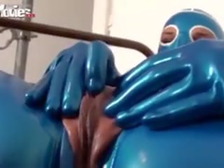 Kinky Fiona In Blue Latex Showing Her Pussy Slit