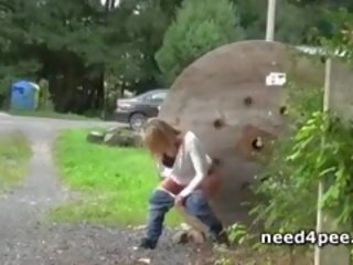 Blonde On Heels Pissing At A Building Entrance