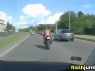 Topless Tattooed Chick Riding A Motorcycle